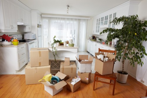 Moving van and removal crew outside a Greenwich home with access challenges