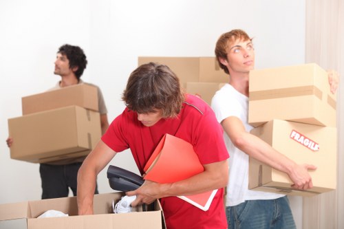 Furniture and boxes being loaded by a Greenwich moving team