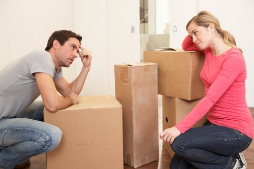 Team lifting furniture carefully as part of a safe removals service