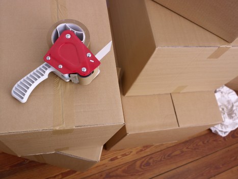 Family preparing boxes for a house move in Greenwich