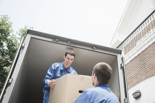 Professional man and van team working safely during a removal